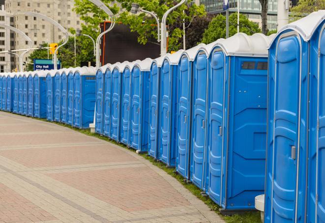 a row of portable restrooms at a fairground, offering visitors a clean and hassle-free experience in elreno